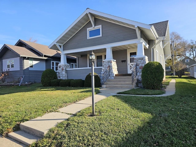 craftsman house featuring a porch and a front yard