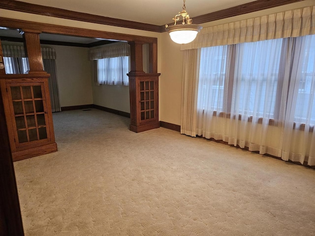 carpeted spare room with ornamental molding