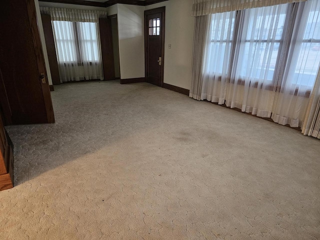 carpeted entryway with plenty of natural light