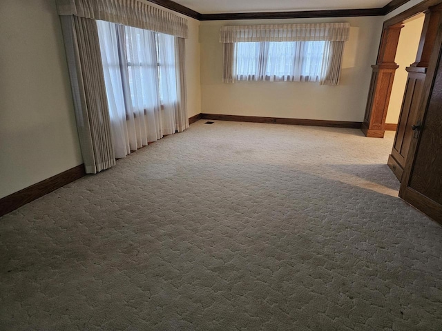 carpeted empty room with crown molding