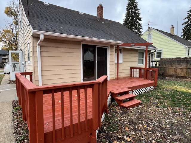 rear view of house featuring a deck