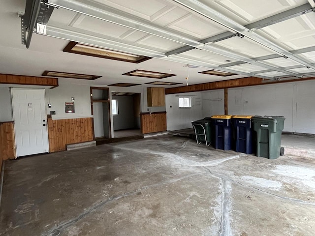 garage featuring wooden walls