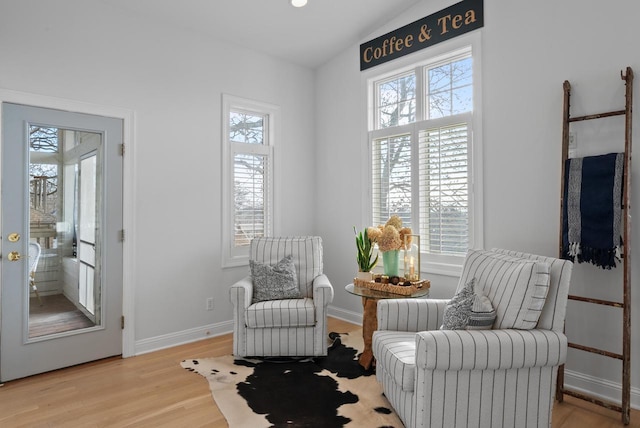 sitting room featuring light hardwood / wood-style flooring