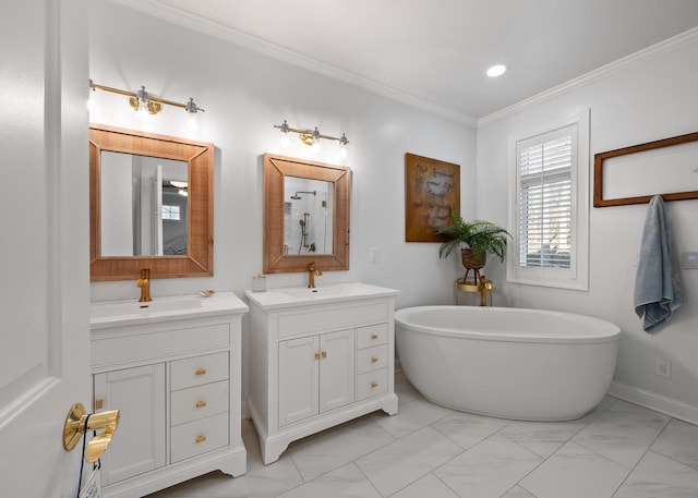 bathroom with a bathtub, crown molding, and vanity