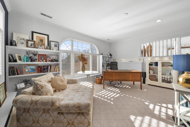 interior space featuring carpet floors and ornamental molding