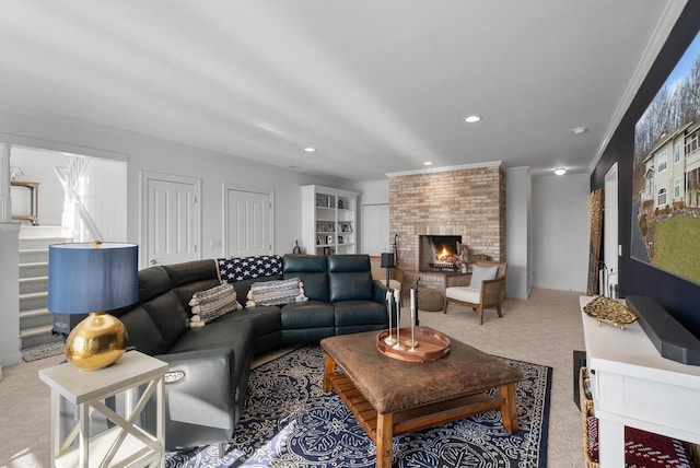 living room with a large fireplace, ornamental molding, and light carpet