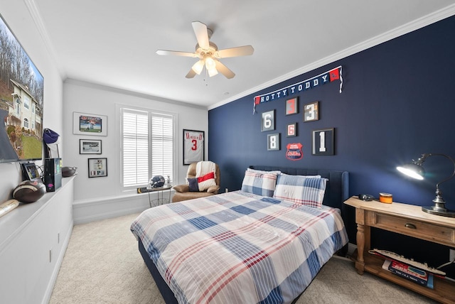 carpeted bedroom with ceiling fan and crown molding