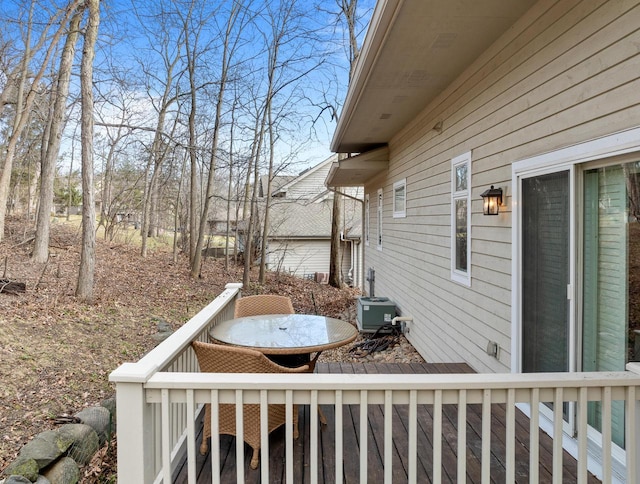 view of yard featuring central air condition unit and a deck