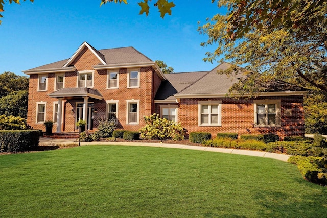 view of front of home with a front lawn