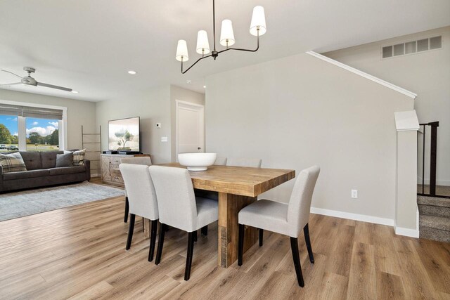 dining space featuring light hardwood / wood-style flooring and ceiling fan