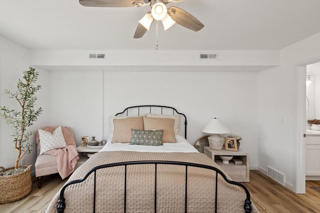 bedroom with ceiling fan and light hardwood / wood-style floors