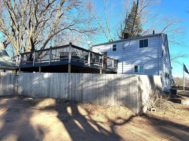 rear view of house featuring a deck