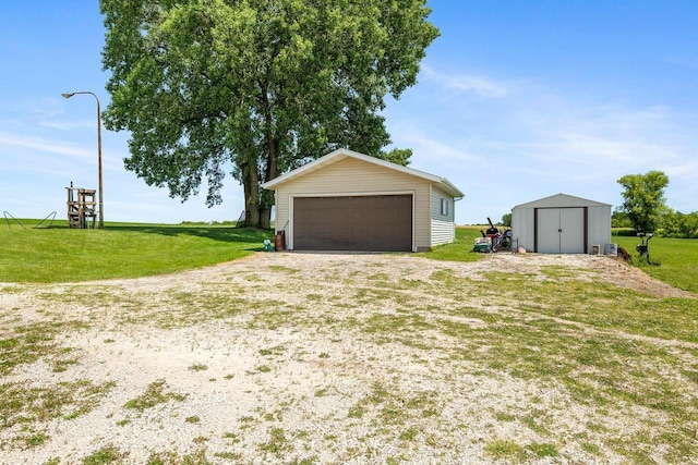 garage with a yard