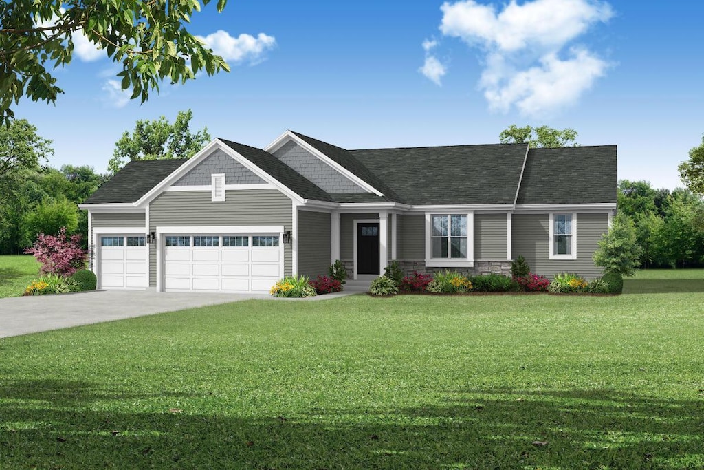 view of front of home featuring a front yard and a garage