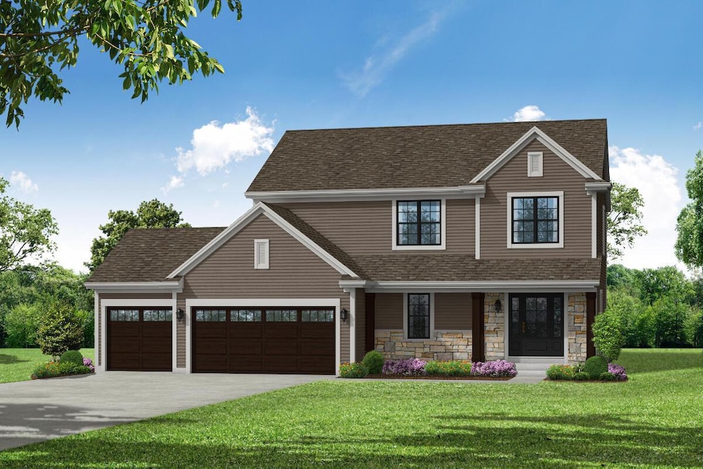 view of front of house featuring a garage and a front lawn