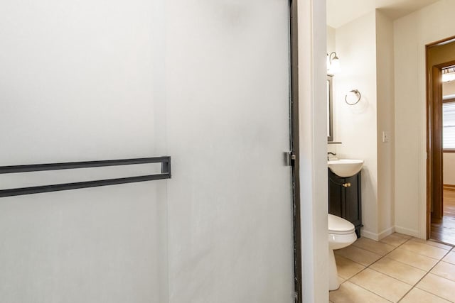 bathroom featuring tile patterned flooring, vanity, and toilet