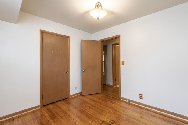 spare room with light hardwood / wood-style flooring