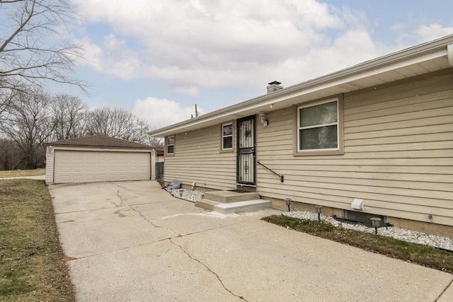 view of front of home with an outbuilding and a garage