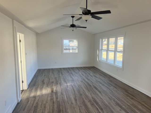 unfurnished room featuring dark hardwood / wood-style floors, ceiling fan, and lofted ceiling