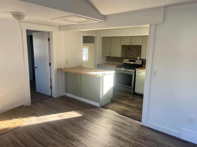 kitchen featuring green cabinets, dark hardwood / wood-style flooring, wooden counters, backsplash, and stainless steel stove