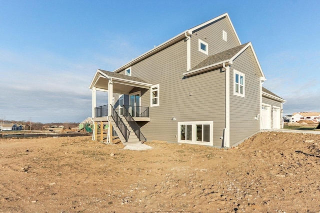 back of house with a garage