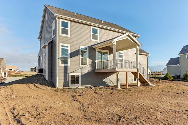 rear view of house with stairs