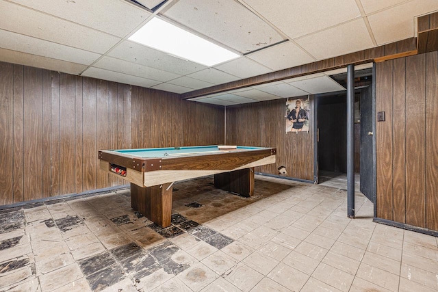 game room with wood walls, a drop ceiling, and billiards