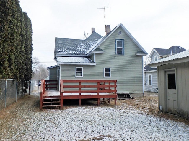 rear view of property with a wooden deck