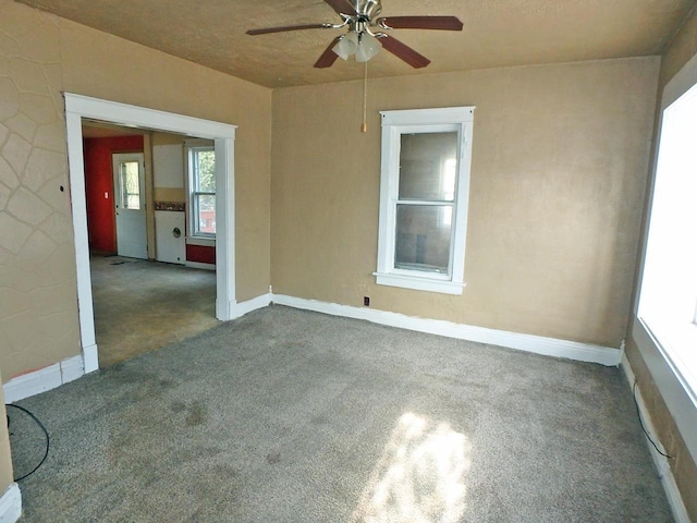 spare room with ceiling fan and carpet floors