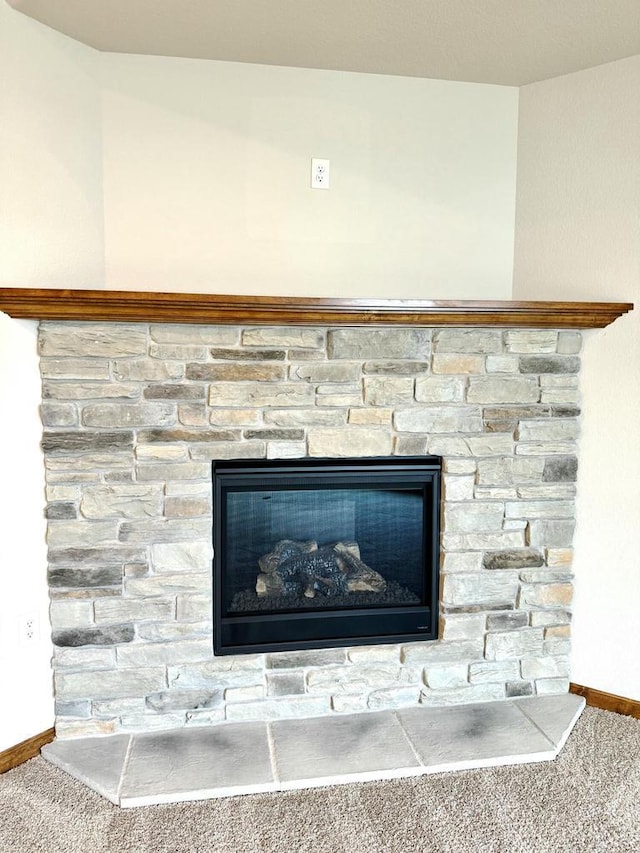 details featuring carpet floors and a fireplace