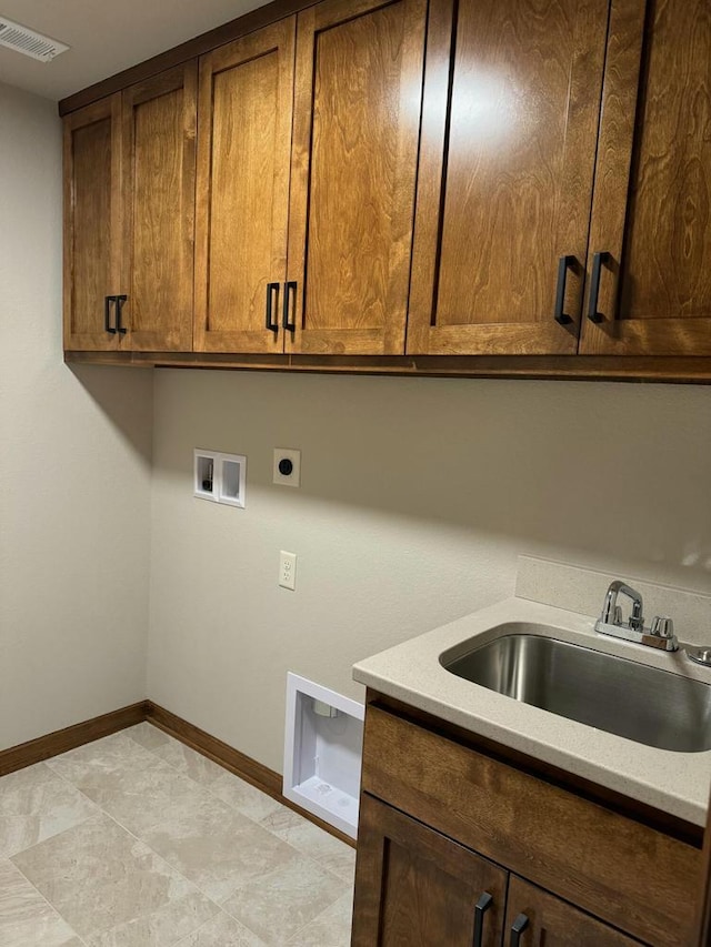 laundry room with cabinets, hookup for a washing machine, electric dryer hookup, and sink