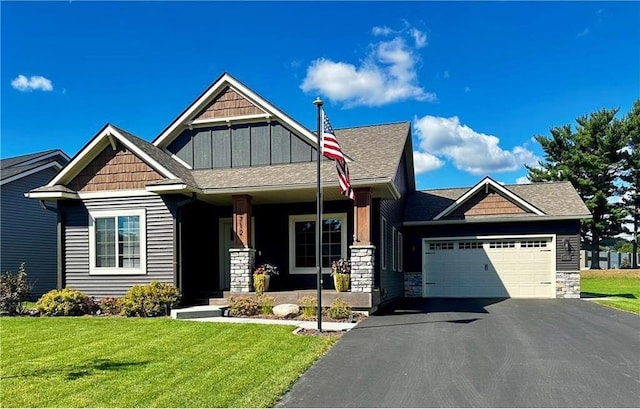 craftsman-style home with a porch, a garage, and a front lawn