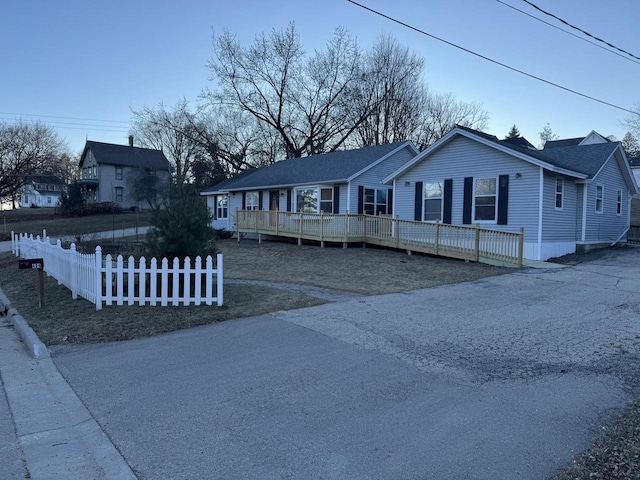 view of front of home featuring a wooden deck