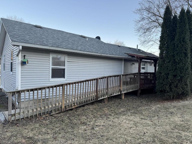 back of property featuring a deck