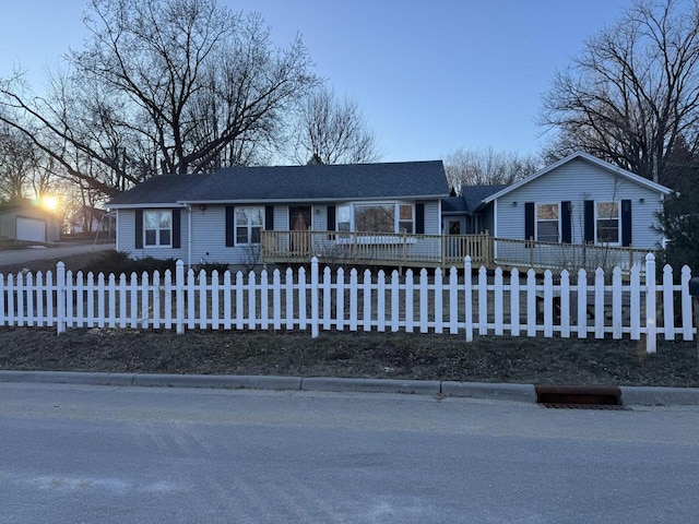 ranch-style home with a deck