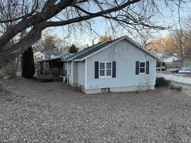 view of side of home featuring central air condition unit