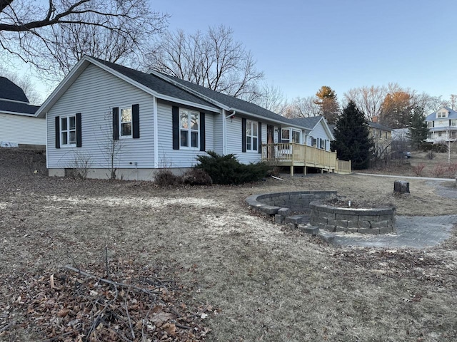 view of side of property featuring a deck