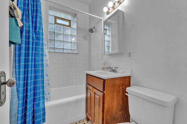 full bathroom featuring vanity, toilet, and shower / bathtub combination with curtain