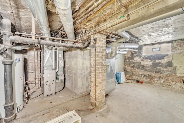 basement featuring heating unit and water heater