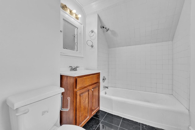 full bathroom featuring vanity, tile patterned floors, vaulted ceiling, tiled shower / bath combo, and toilet