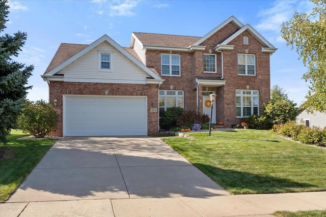 view of front facade with a front yard and a garage