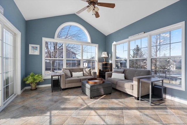 living room with vaulted ceiling, ceiling fan, and plenty of natural light