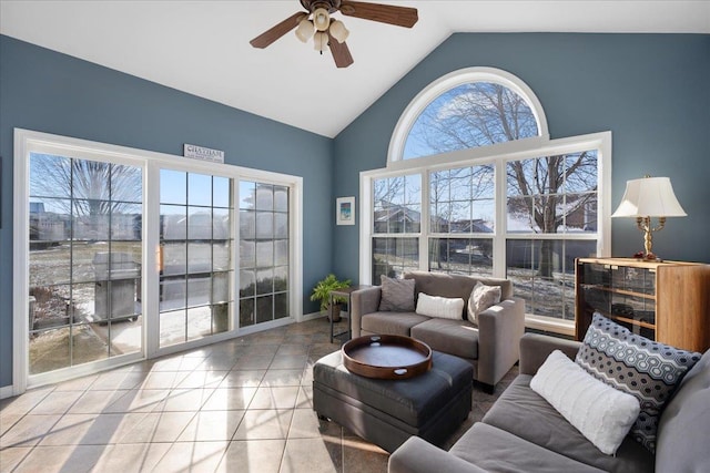 living room featuring high vaulted ceiling, ceiling fan, and light tile patterned floors