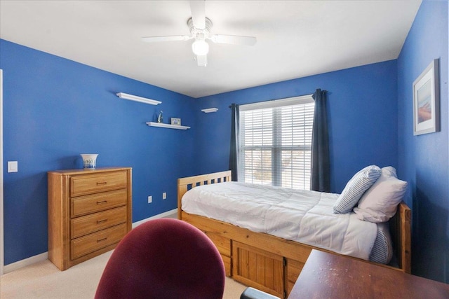 bedroom featuring ceiling fan and light colored carpet