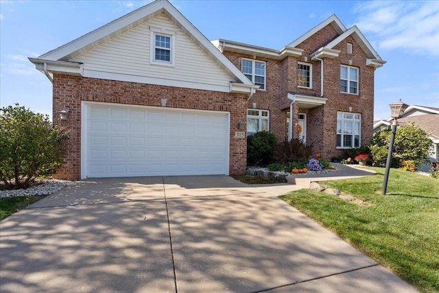 view of front of house with a garage and a front lawn