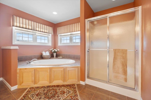 bathroom featuring shower with separate bathtub and tile patterned floors