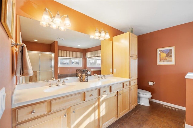 full bathroom featuring toilet, an inviting chandelier, tile patterned floors, plus walk in shower, and vanity