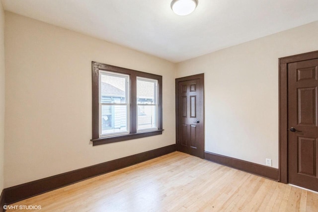 unfurnished room with light hardwood / wood-style floors