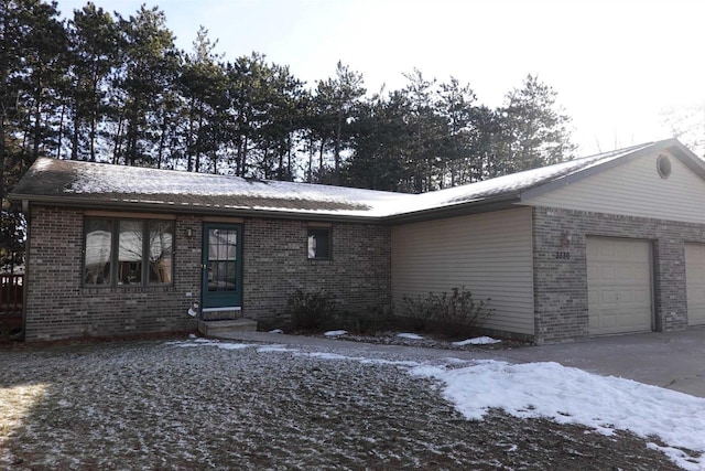 ranch-style home featuring a garage