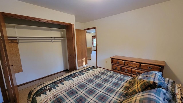 carpeted bedroom with a closet